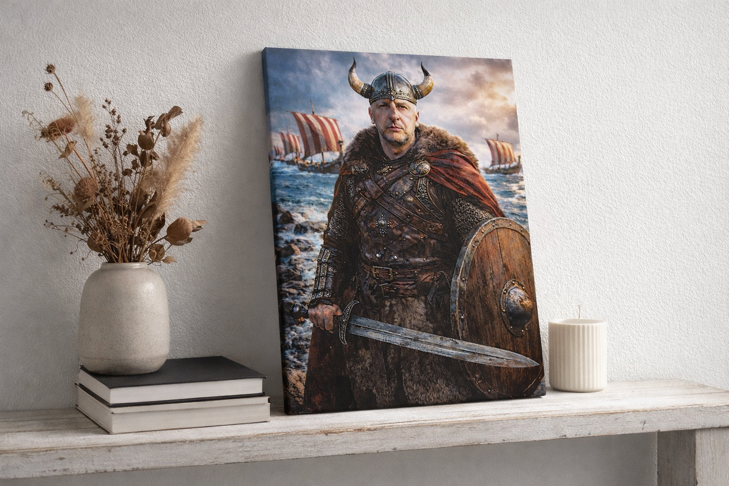 Personalised photo turned into a Viking warrior canvas print, showing a horned Viking holding a sword and shield with longships at sea, displayed upright on a shelf.